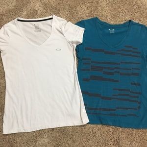 2 short sleeve Oakley shirts: white and teal print